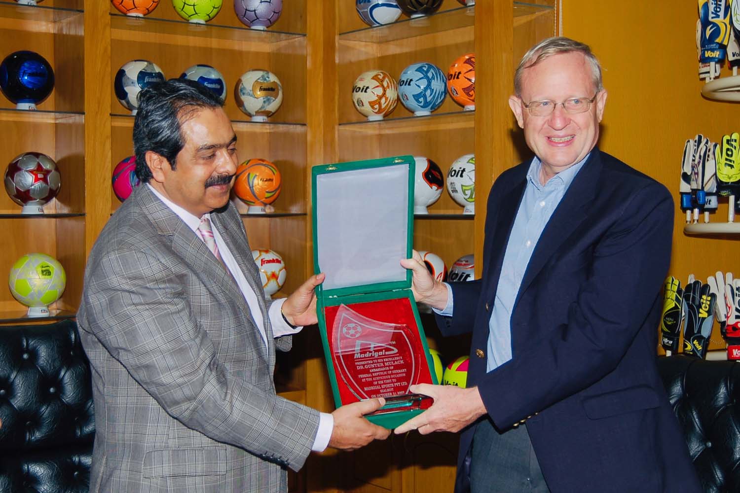 German Ambassador presenting achievement shield to our CEO.